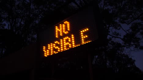 a sign flashes at the top of the hawaii volcano kilauea to show that no lava is currently visible at the volcano crater