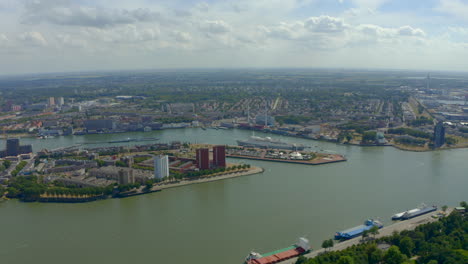 drone shot towards rotterdam harbour docks