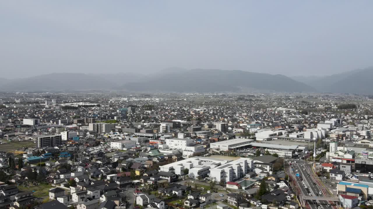 Aerial View Of Matsumoto City In Nagano Prefecture With Hazy Misty Air In Distant Background