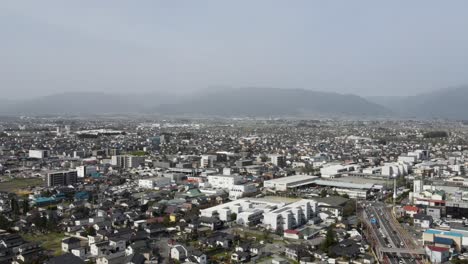 aerial view of matsumoto city in nagano prefecture with hazy misty air in distant background