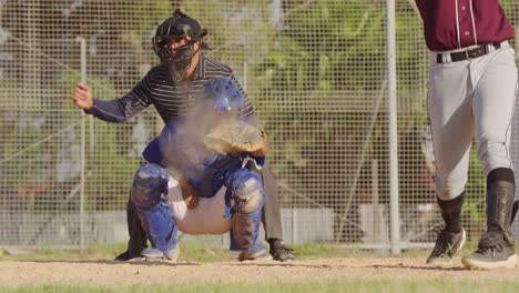 baseball player catching a ball during a match