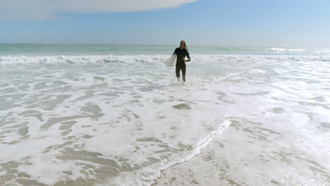 surfer with surfboard running with surfboard 4k