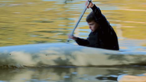 Young Boy Kayaking on the Water