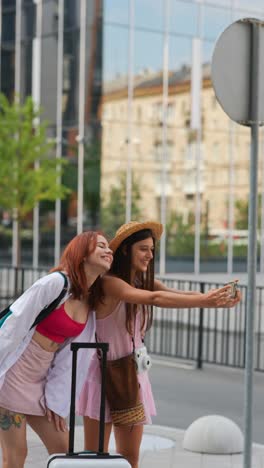 two friends taking a selfie while traveling