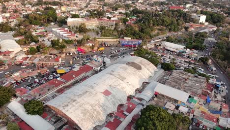 mercado adolfo lópez in cuernavaca, showing traffic and bustling city life, mexico. aerial panoramic shot