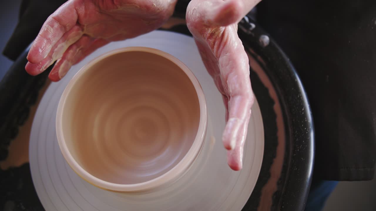 Potter's wheel potter works with his hands