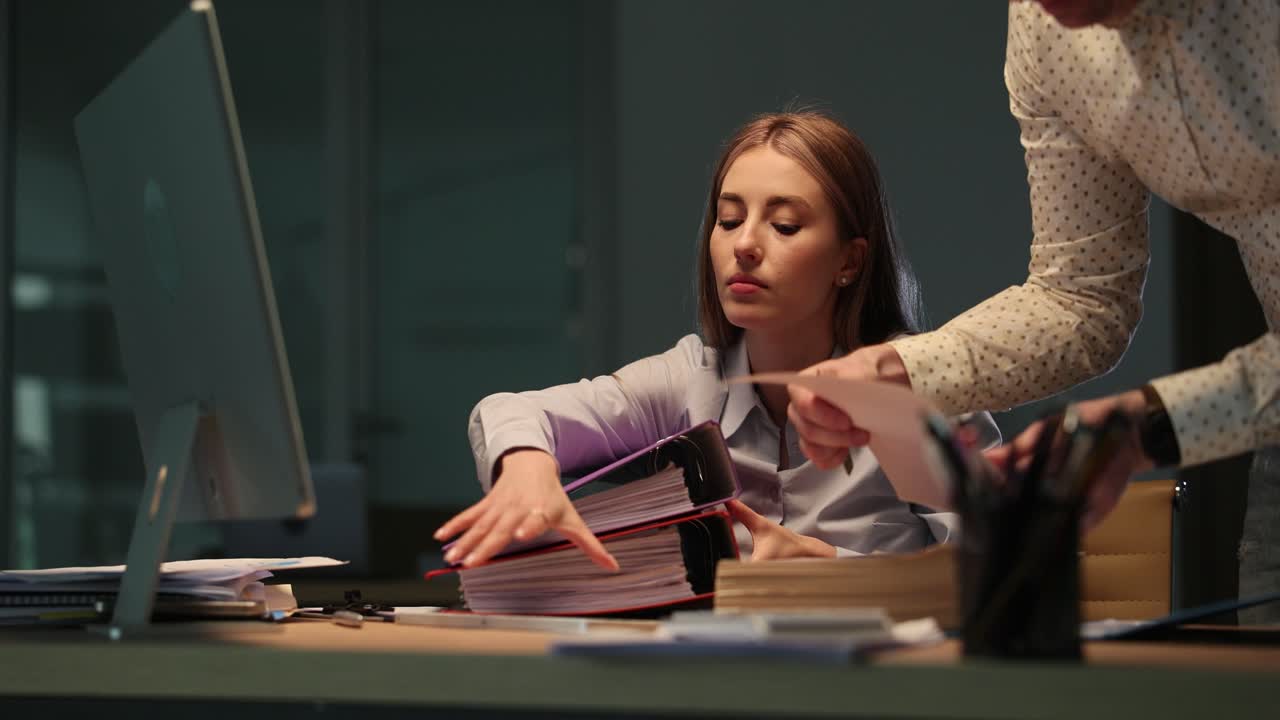 Overtime Work in the Office: Professionals Handling Documents and Files