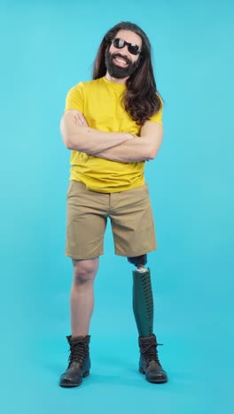 man with prosthetic leg posing confidently in a studio