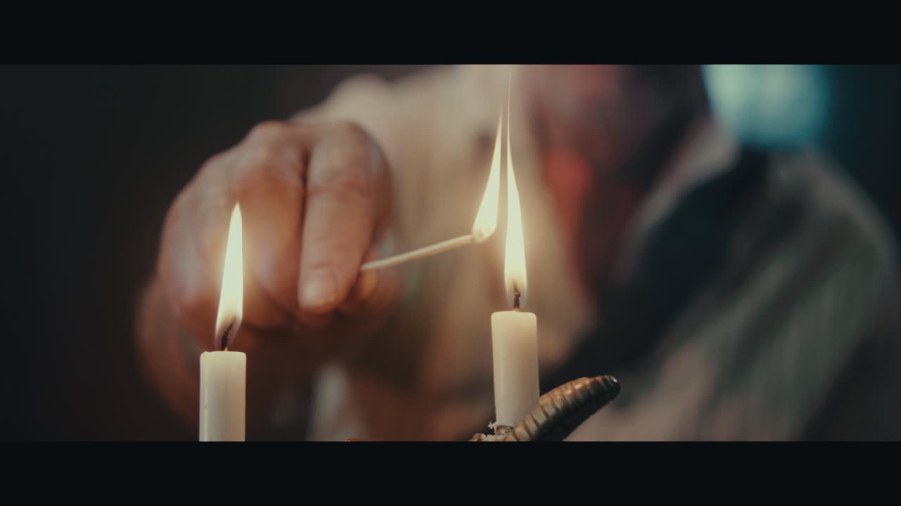 An old pirate capitan smokes a pipe inside the sailing ship cabin