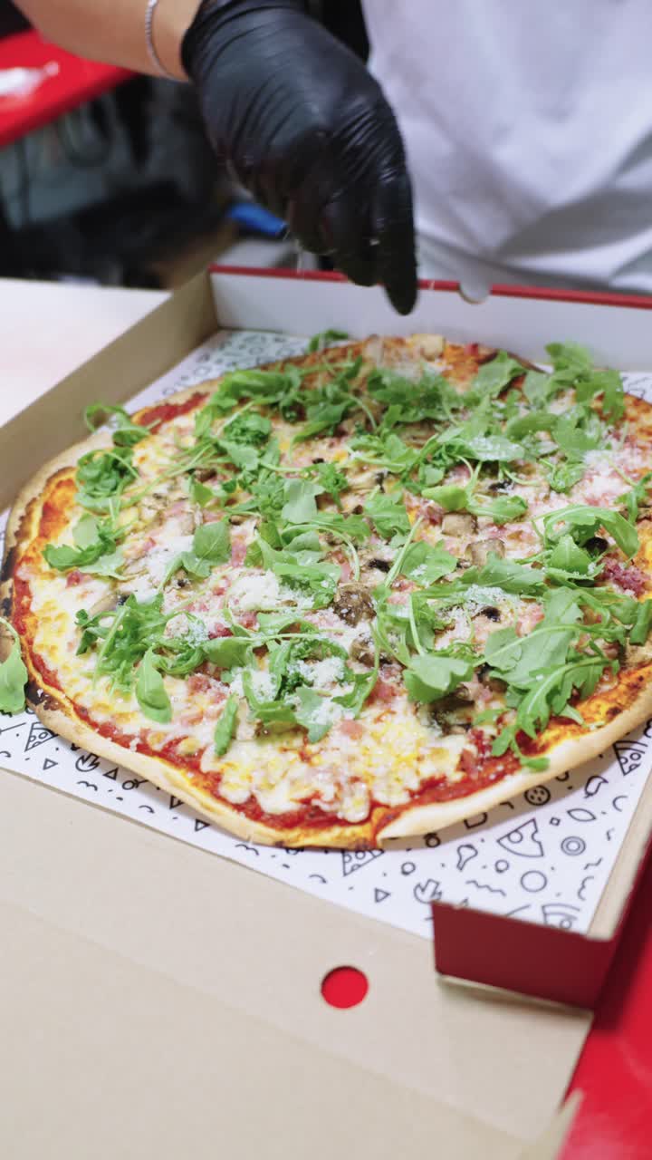 Pizza with arugula in a box