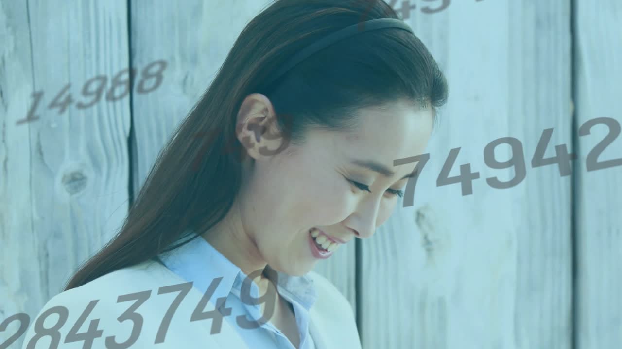 Mid-adult woman tapping tablet screen outdoors for business data review, numeric overlays animating