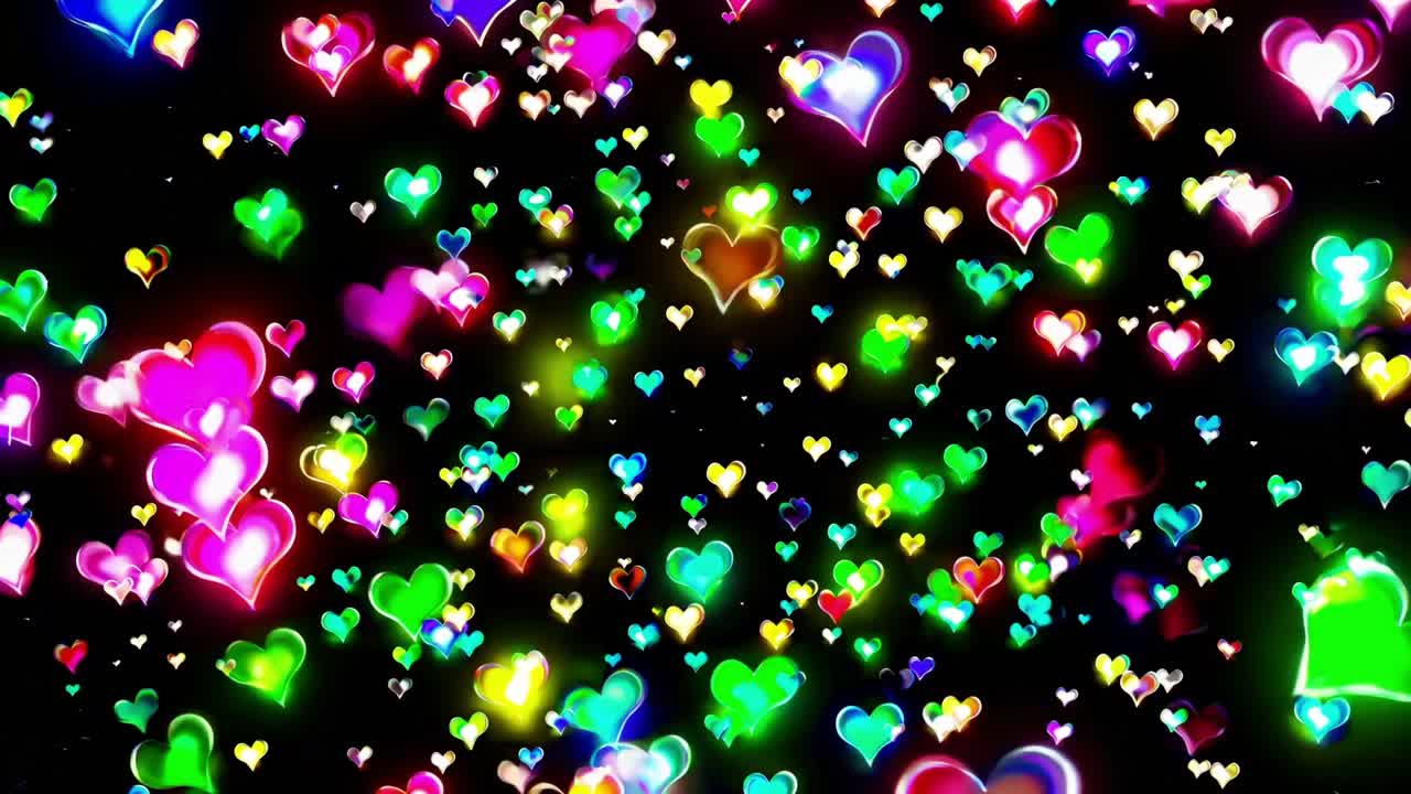 Colorful hearts in vibrant hues float dynamically across a dark background, creating a mesmerizing visual display of love and joy in a continuous motion sequence