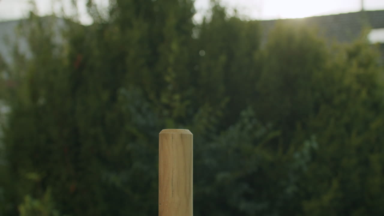 Driving a Wooden Post with a Mallet