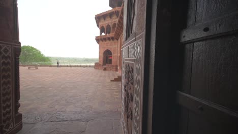 panning shot through an ornate corridor in india