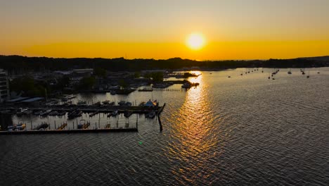 Sun-setting-in-brilliant-yellows-over-several-marinas-and-docks