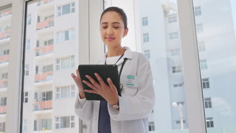 Tablet,-happy-and-woman-doctor-in-the-hospital