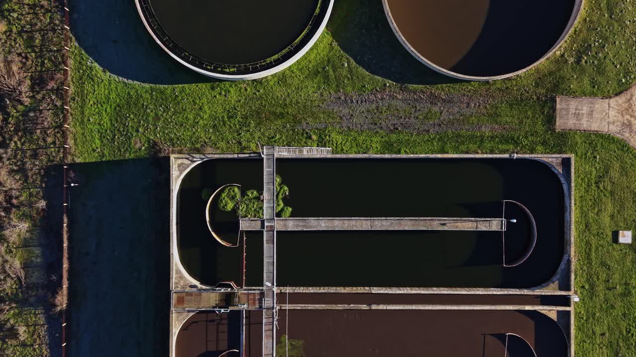 Water treatment facility shows several large tanks for processing water