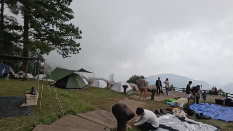 group of people setting up and taking down tents