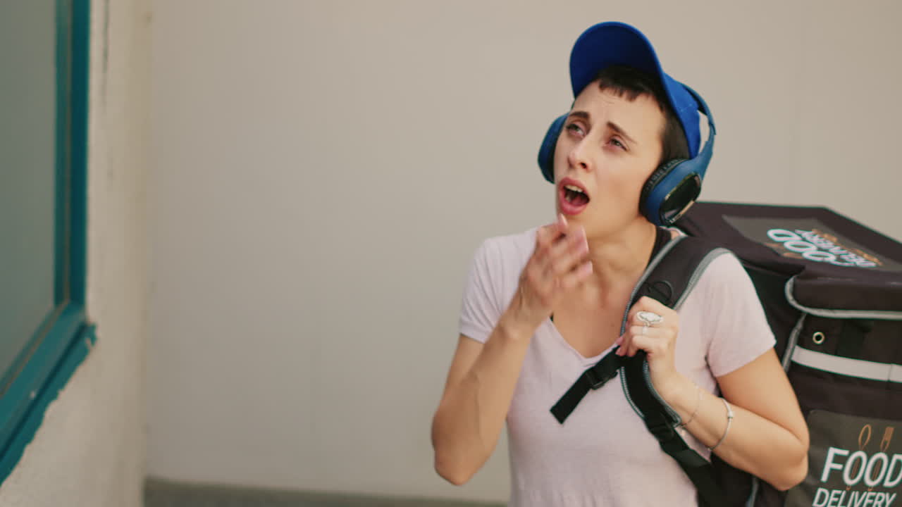 Delivery person ringing doorbell