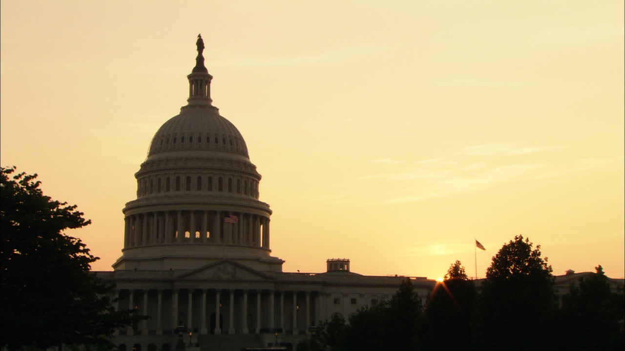 Zoom In To U.S. Capitol Dome In Silhouette At Sunset, Washington, D.C.