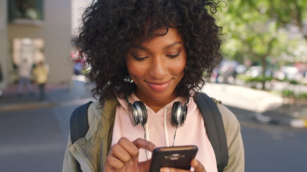 A young stylish black female student using