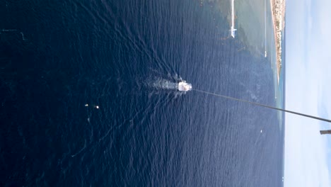 pov view of parasailing over the sea