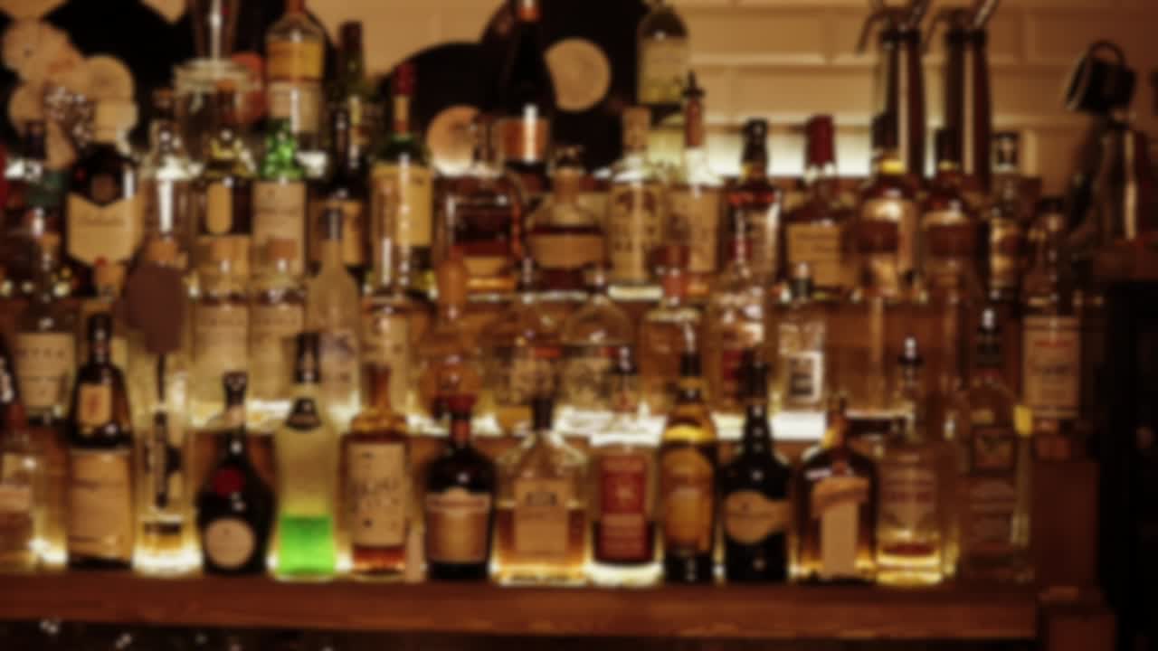 Blurred Bar Shelf with Liquor Bottles