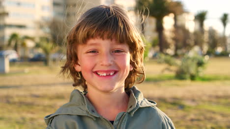 child, face and smile for freedom in nature park