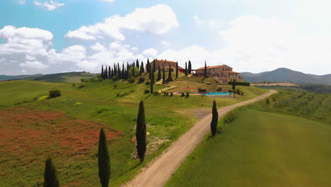 beautiful aerial shot of an italian villa on a hill in tuscany italy, 4k