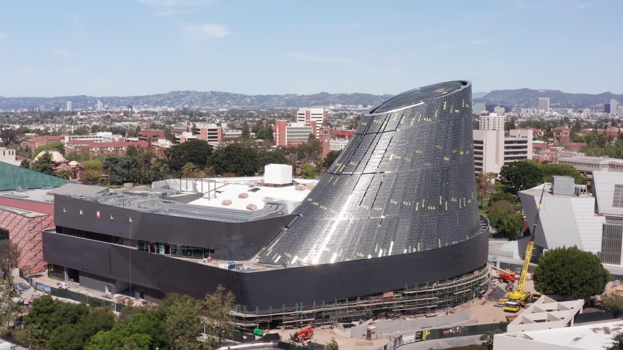 Wide panning aerial shot of the Samuel Oschin Air and Space Center under construction in Los Angeles, California. 4K