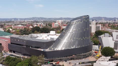 wide panning aerial shot of the samuel oschin air and space center under construction in los angeles, california. 4k