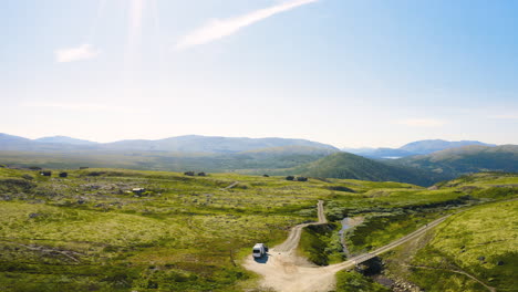 view of an isolated camper van amidst remote terrain at rondane national park at summer in norway