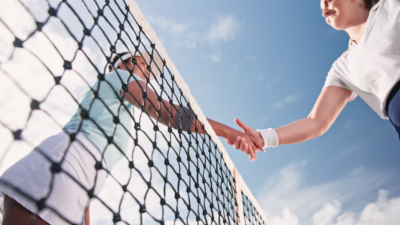 Volleyball players shaking hands after the game