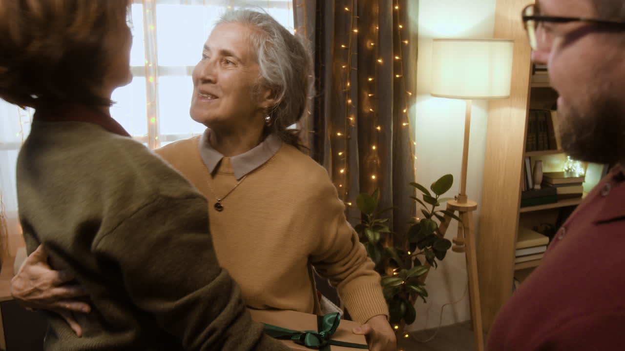 Family celebrating Christmas and exchanging gifts