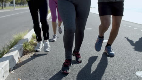 sporty confident runners exercising together outdoors