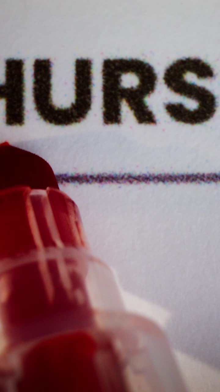 Close-up of a form with the word "HOURS" and a red marker