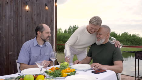 two men sitting, about to have dinner