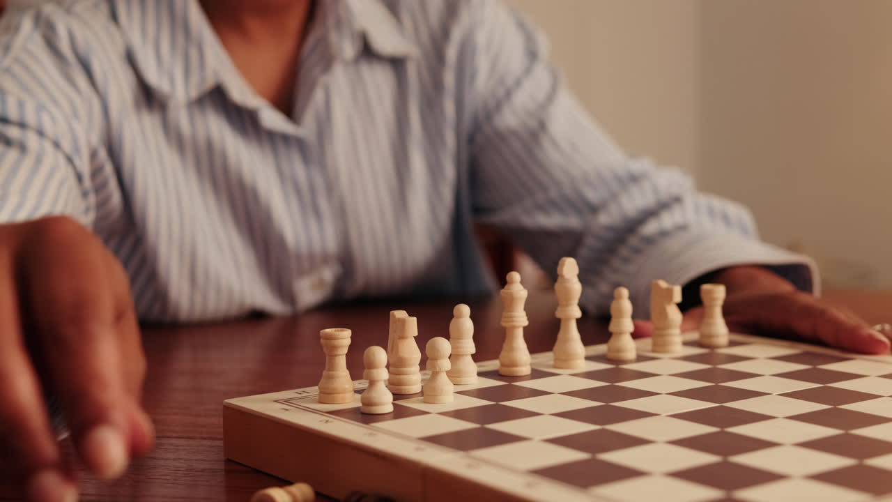 Woman Sets Up Chess Pieces on a Board