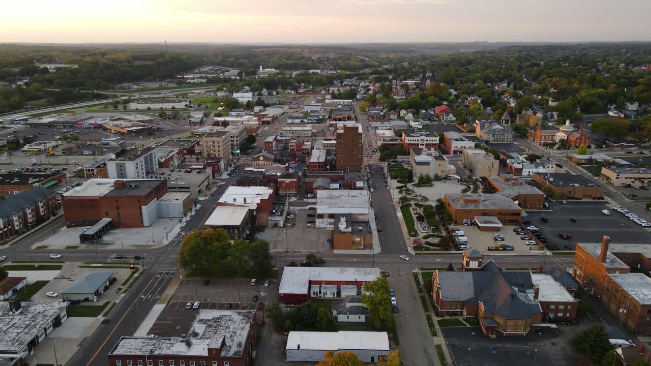 Aerial view of downtown Massillon, Ohio at sunset featuring historic buildings and streets. Crane Down Sunset N