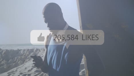 Speech-bubble-with-increasing-likes-against-african-american-fit-man-using-smartphone-at-the-beach