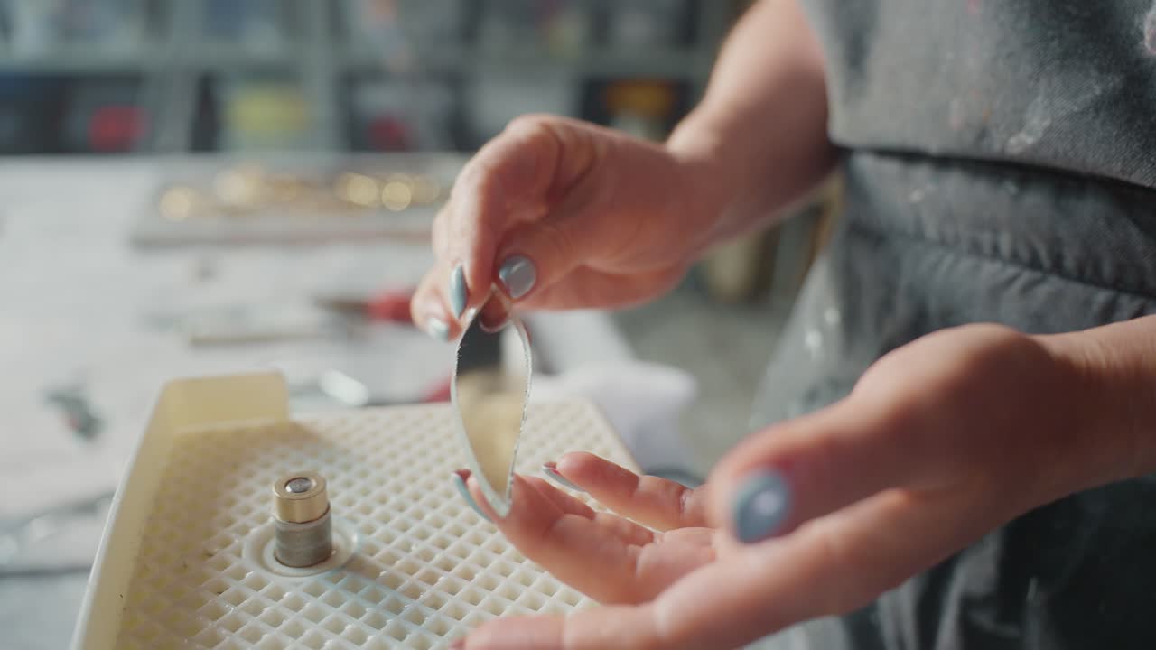 Woman Crafting Glass Jewelry