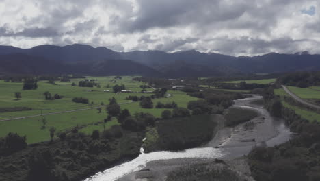 Aerial-drone-shot-over-the-green-countryside-near-Blackball,-South-Island-New-Zealand