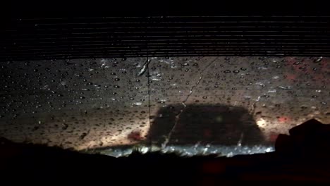 Rear-windshield-car-view-low-visibility-while-raining-very-hard-like-a-typhoon-and-hurricane-in-Dubai,-United-Arab-Emirates