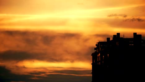 establishing timelapse shot of an apartment building at sunset in utrecht.