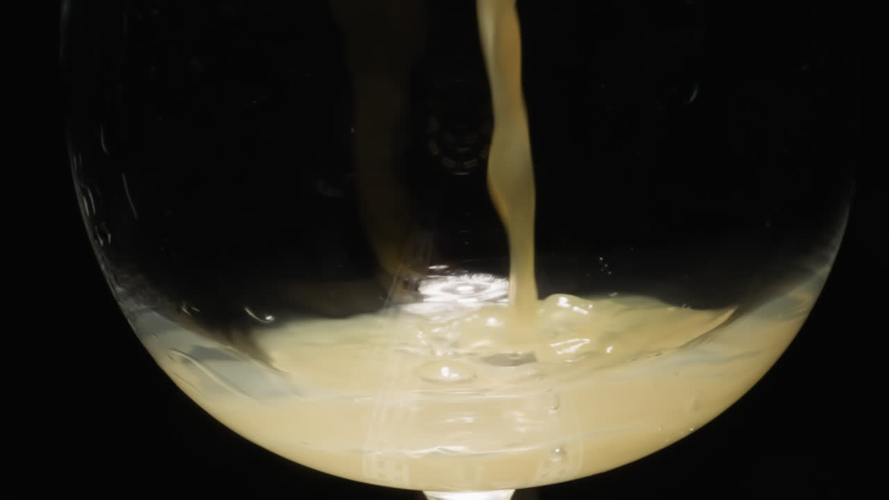 Cocktail with alcohol and grapefruit juice poured into glass