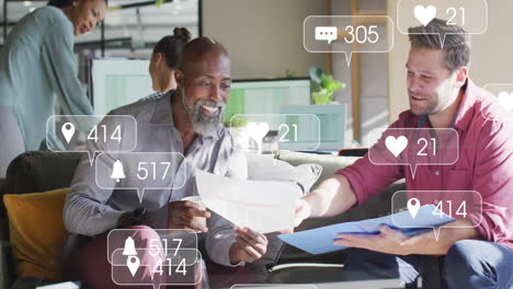 Animation-of-multiple-notification-bars-over-diverse-coworkers-discussing-reports-in-office