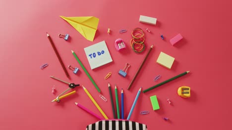 Video-of-case-with-school-items-on-pink-surface