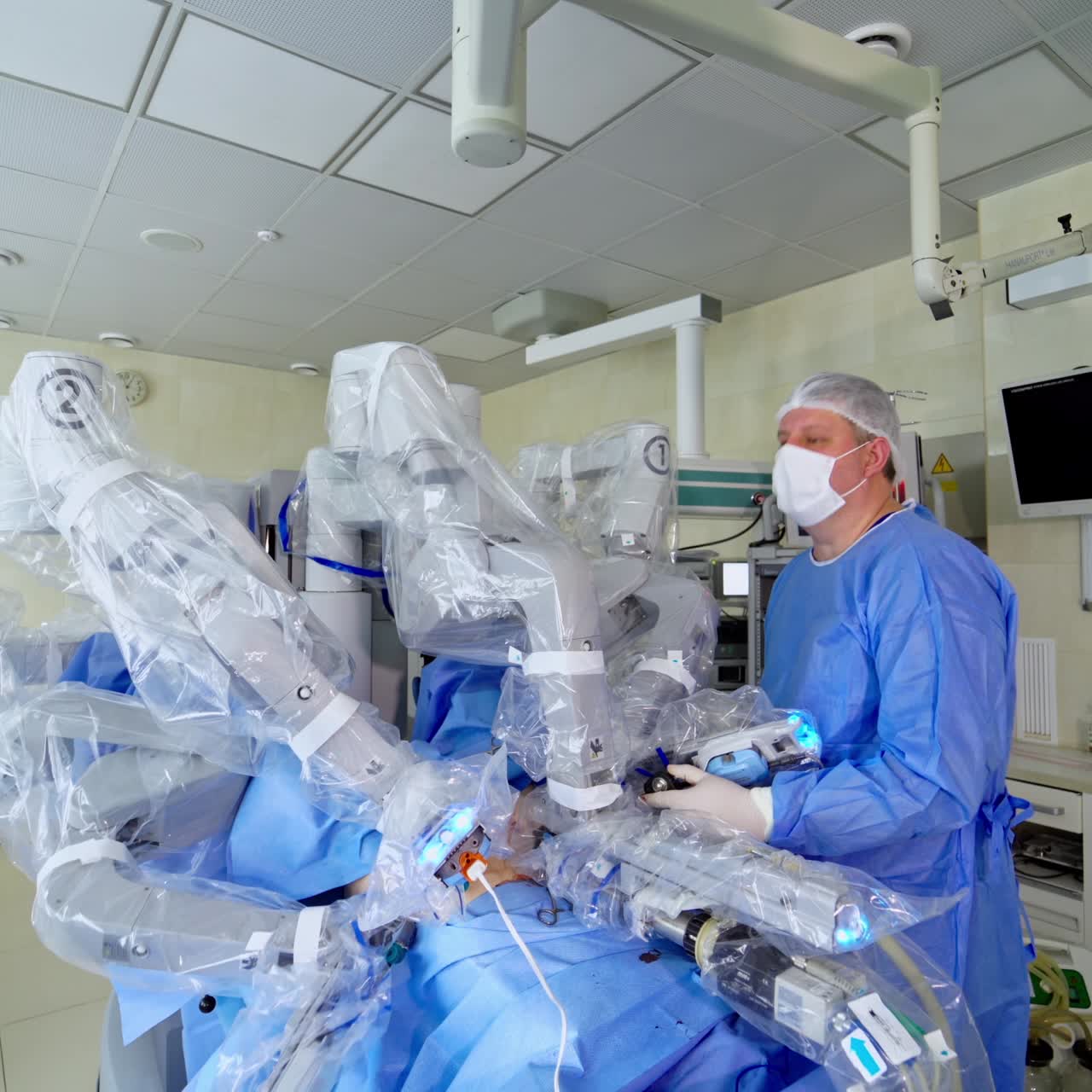 Medical surgical robot perform an operation. Robotic machine doing an operation using automated arms. Modern medical equipment with minimal invasive surgery. Doctors control the work of robotic machine