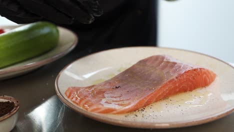 chef preparing seasoned salmon