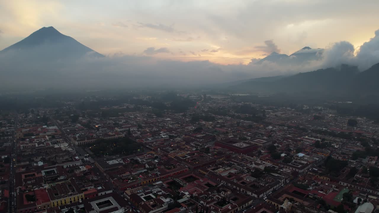 Aerial view over Antigua, Guatamala at Dusk with hazy cloudscape
